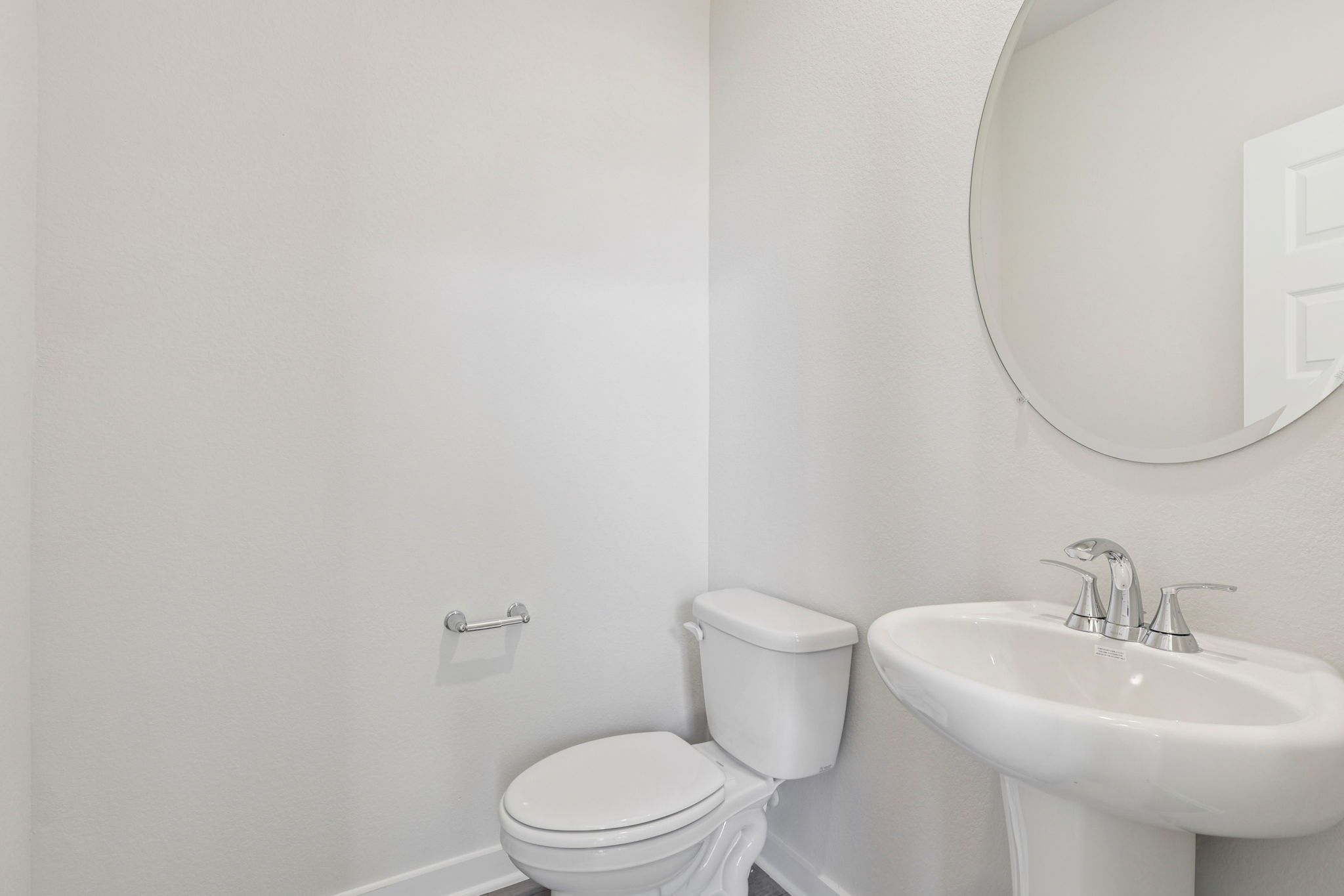 5519 Handlewood Lane Rosenberg, TX 77471 - Photo 14 of 38 a white toilet sitting next to a white sink