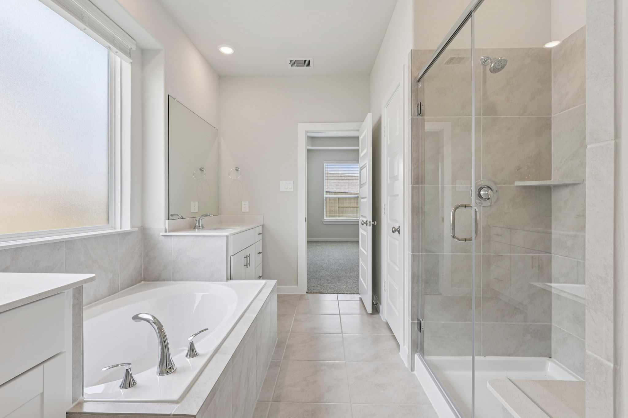 5519 Handlewood Lane Rosenberg, TX 77471 - Photo 20 of 38 a bathroom with a tub shower and sink