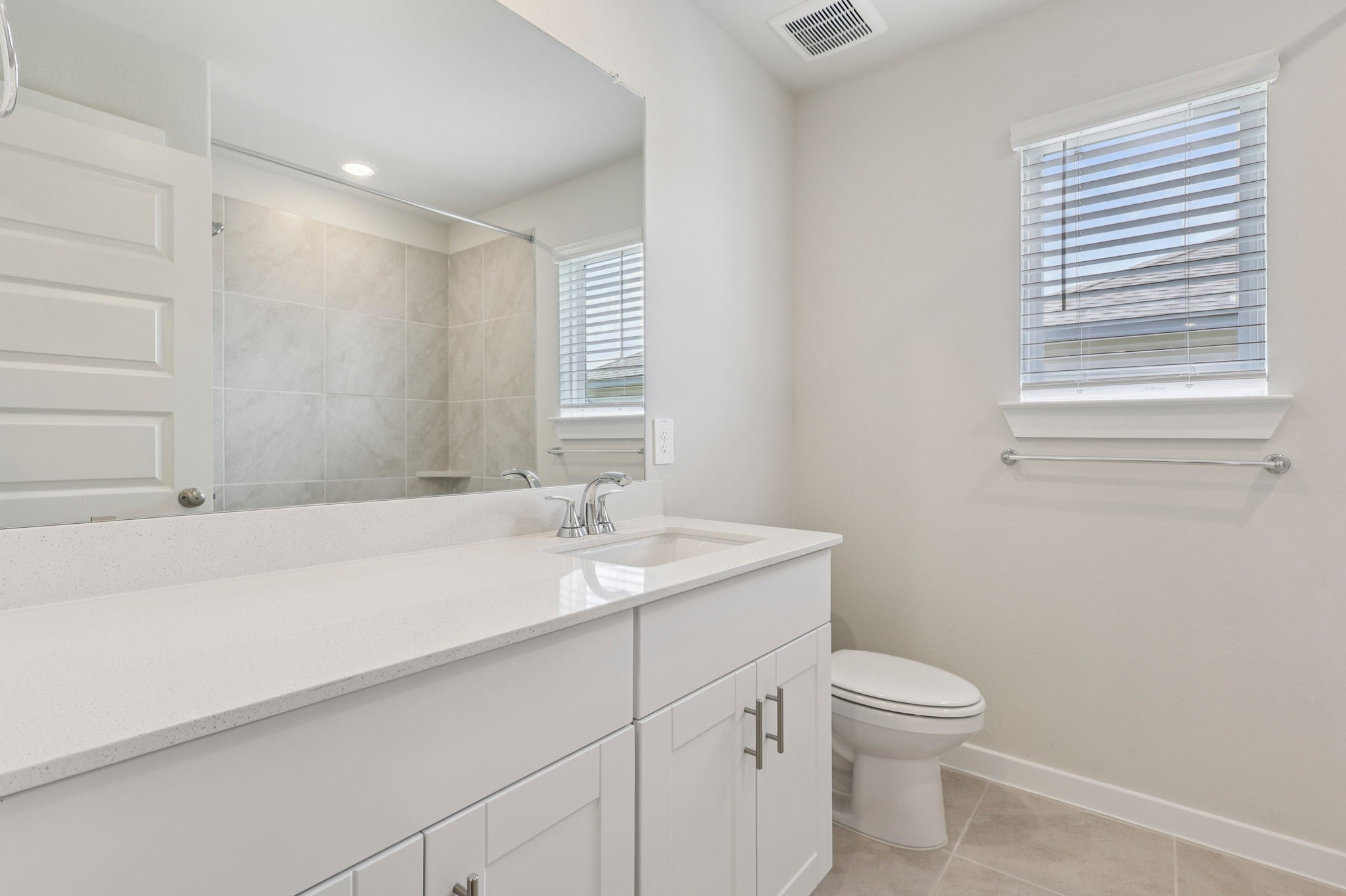 5519 Handlewood Lane Rosenberg, TX 77471 - Photo 30 of 38 a bathroom with a granite countertop sink a toilet and mirror