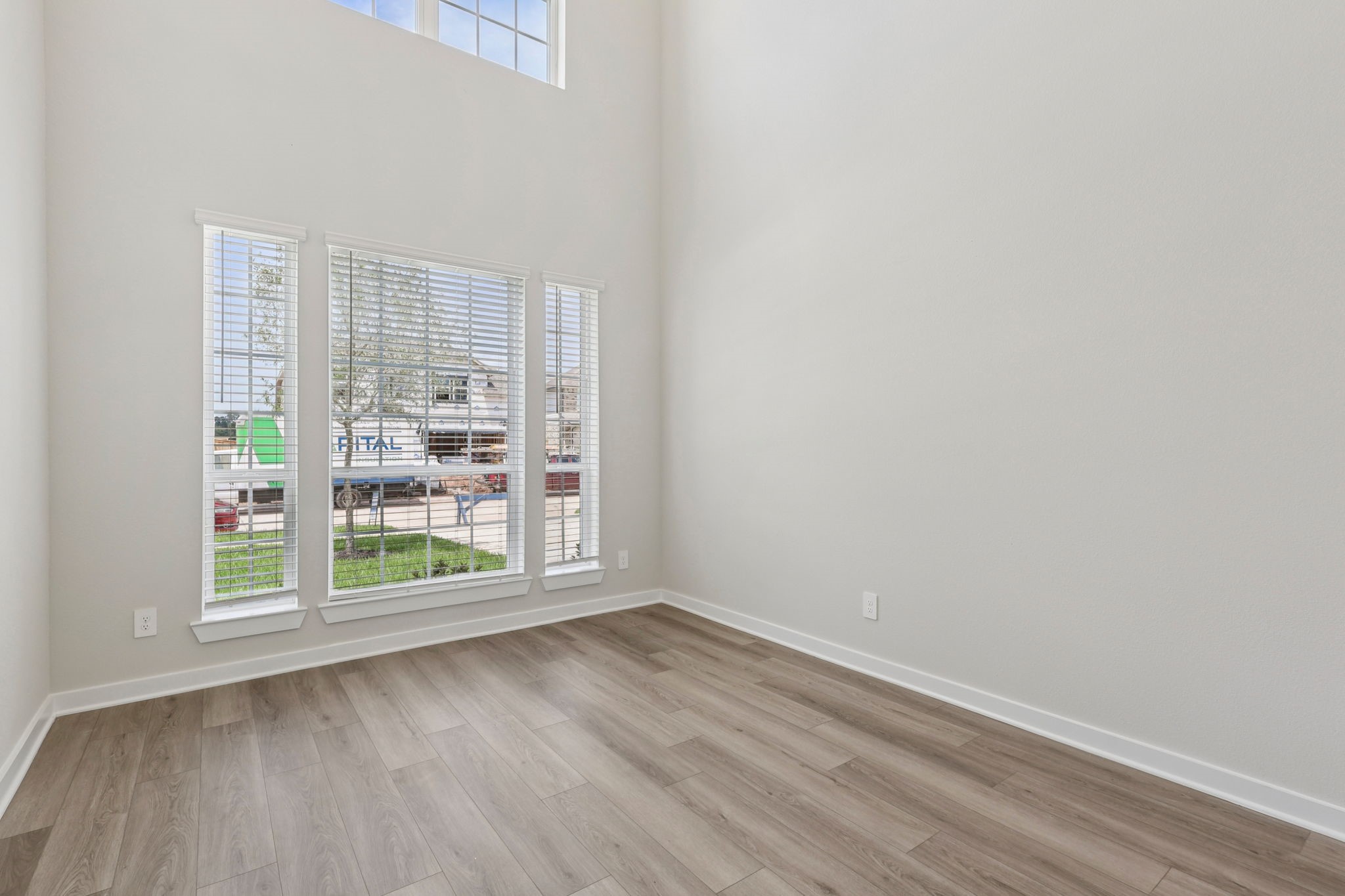 5519 Handlewood Lane Rosenberg, TX 77471 - Photo 7 of 38 a view of a room with wooden floor and window