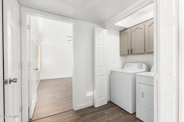 a view of storage room with washer and dryer