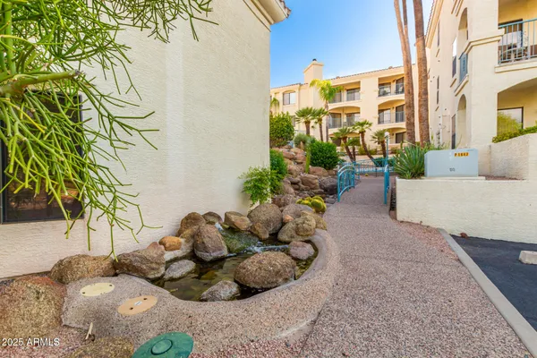 a white house with a trees in front of it