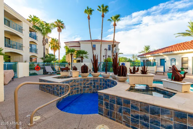 a kitchen with a sink cabinets and appliances