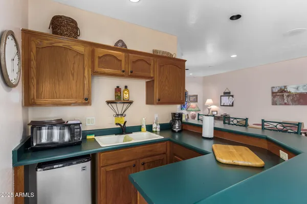 a view of a dining area with furniture and a rug
