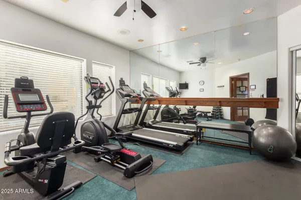 a view of a table and chairs under an umbrella