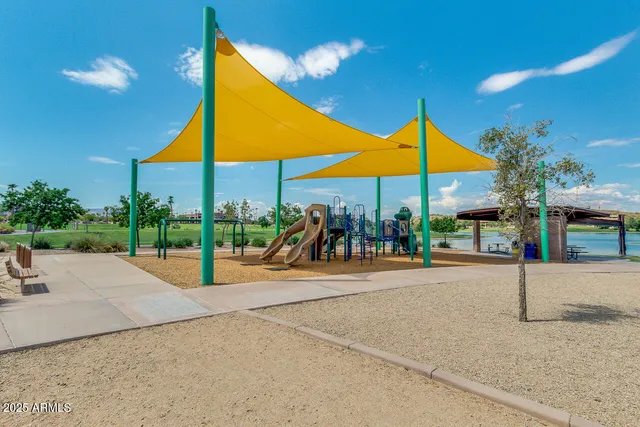 a view of a balcony with a yard