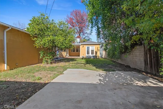 a view of backyard of a house