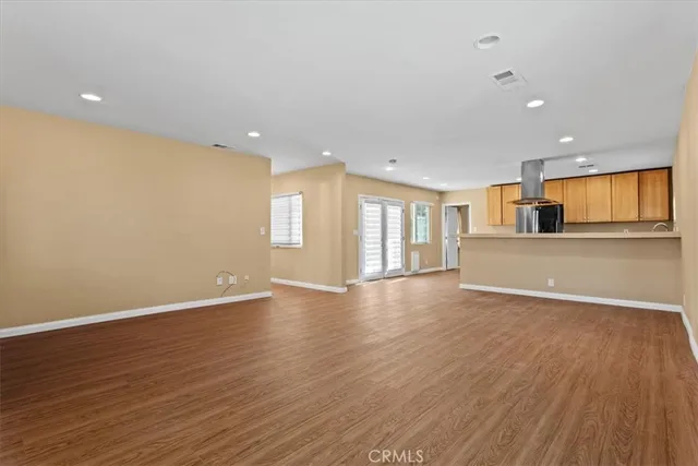 a view of a kitchen with a sink and a window