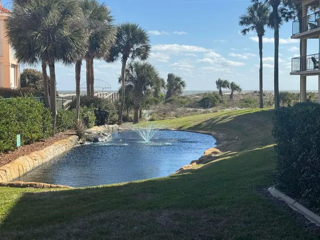 a view of a swimming pool with a yard
