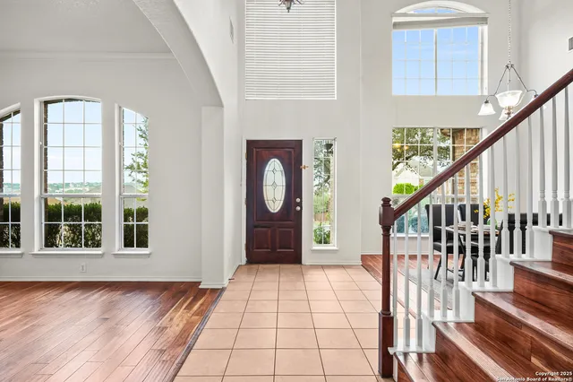 a view of an entryway with wooden floor and door