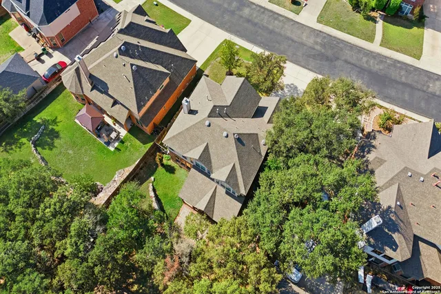 an aerial view of a house with a garden