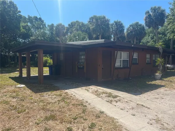 a view of a backyard of the house