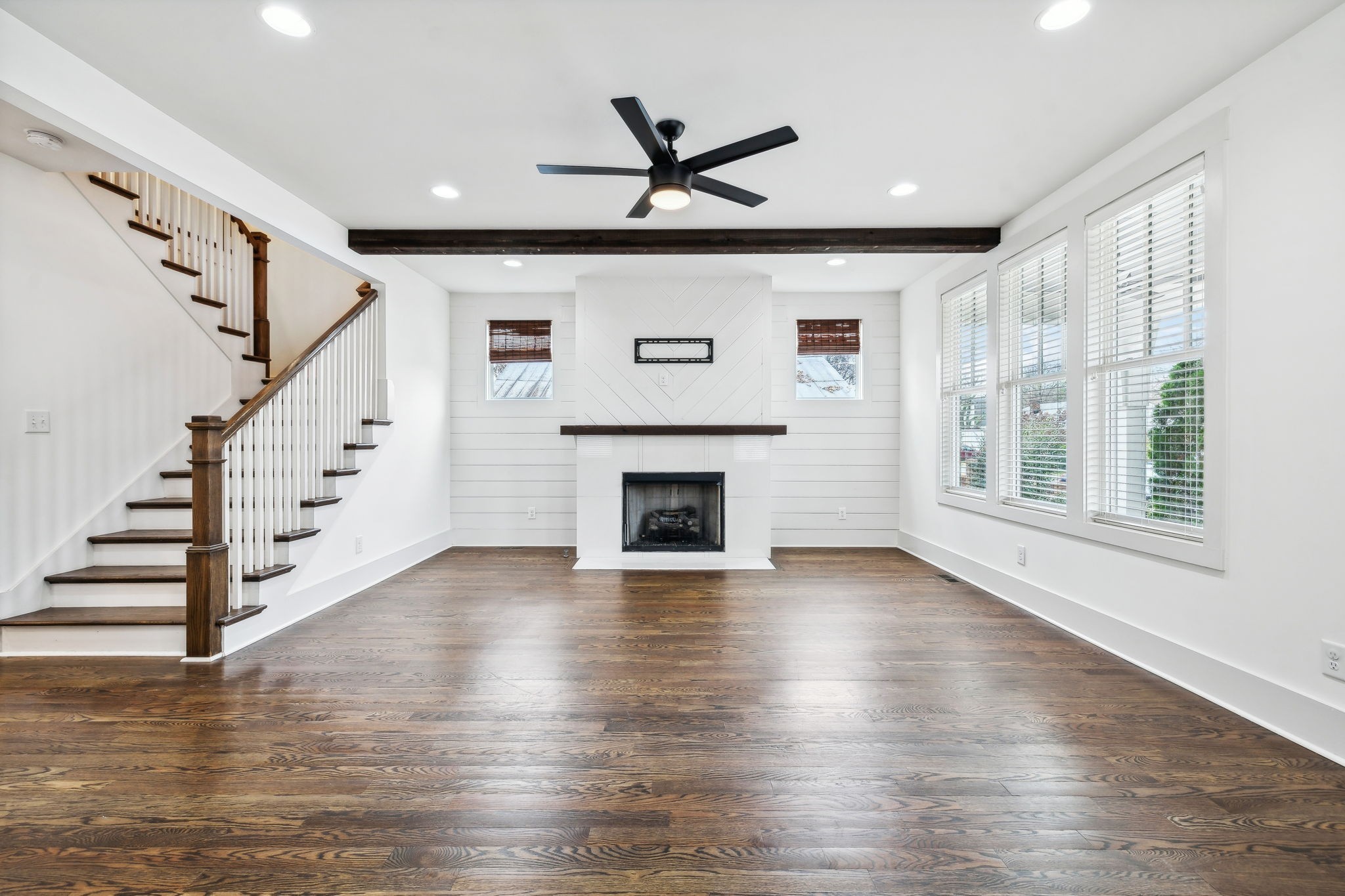 159 Acton Street Franklin, TN 37064 - Photo 11 of 70 a view of a livingroom with wooden floor and a ceiling fan