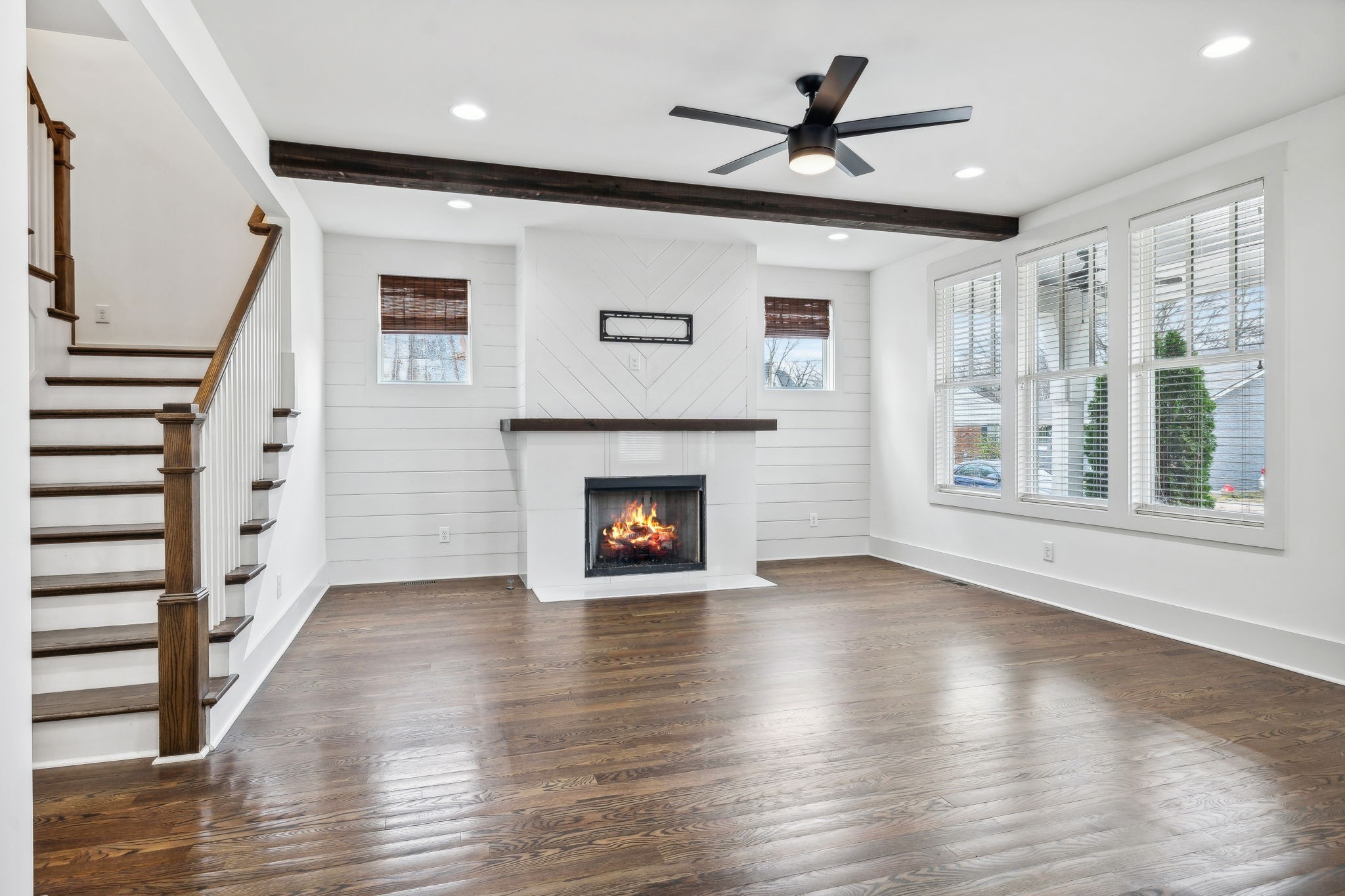 159 Acton Street Franklin, TN 37064 - Photo 12 of 70 a view of an empty room with wooden floor fireplace and a window
