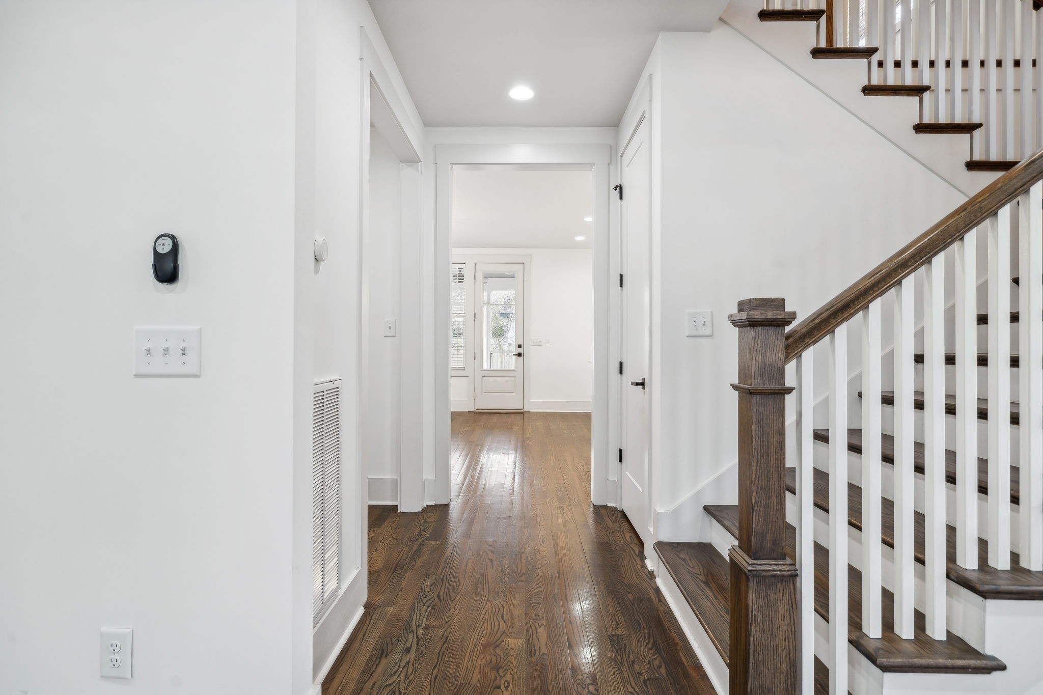 159 Acton Street Franklin, TN 37064 - Photo 19 of 70 a view of a hallway with wooden floor and staircase