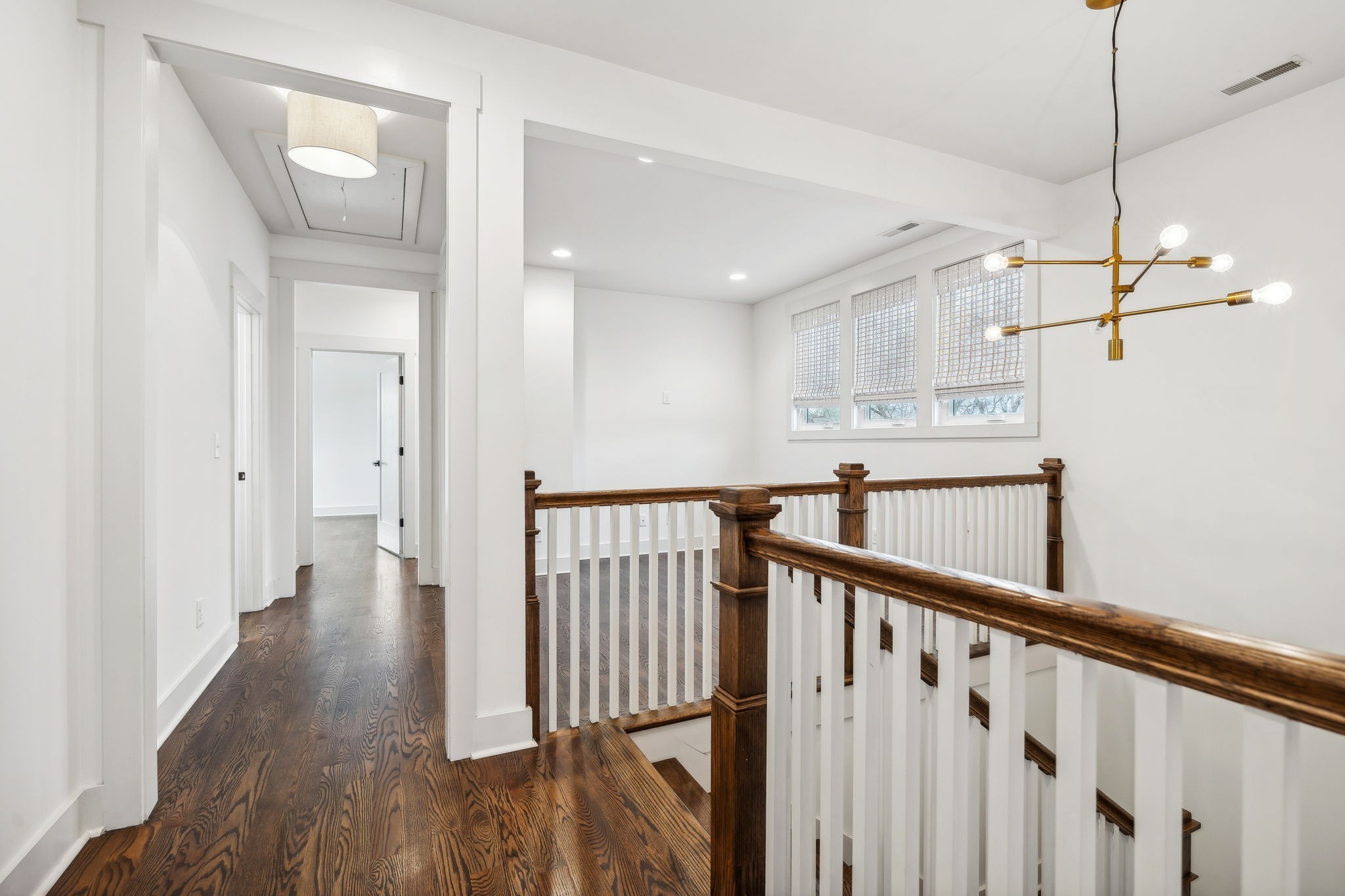 159 Acton Street Franklin, TN 37064 - Photo 36 of 70 a view of a hallway with wooden floor and staircase