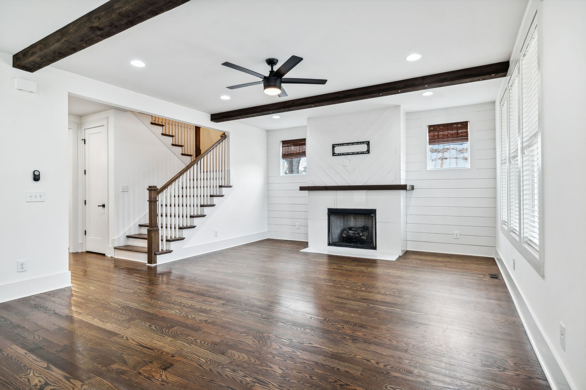 159 Acton Street Franklin, TN 37064 - Photo 10 of 70 a view of a livingroom with wooden floor and a fireplace