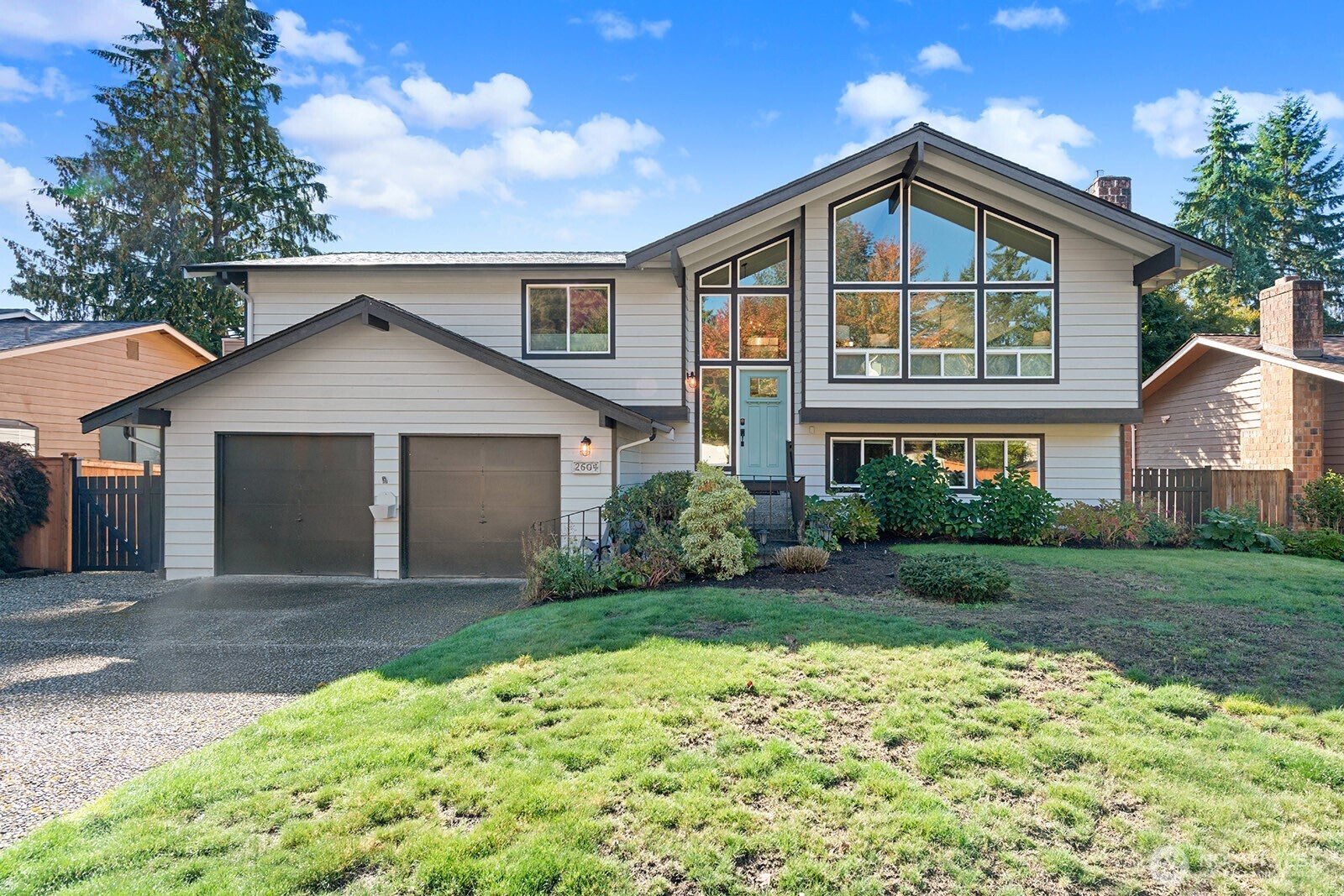 2604 177th Street Southeast Bothell, WA 98012 - Photo 1 of 35 a front view of a house with a yard and garage