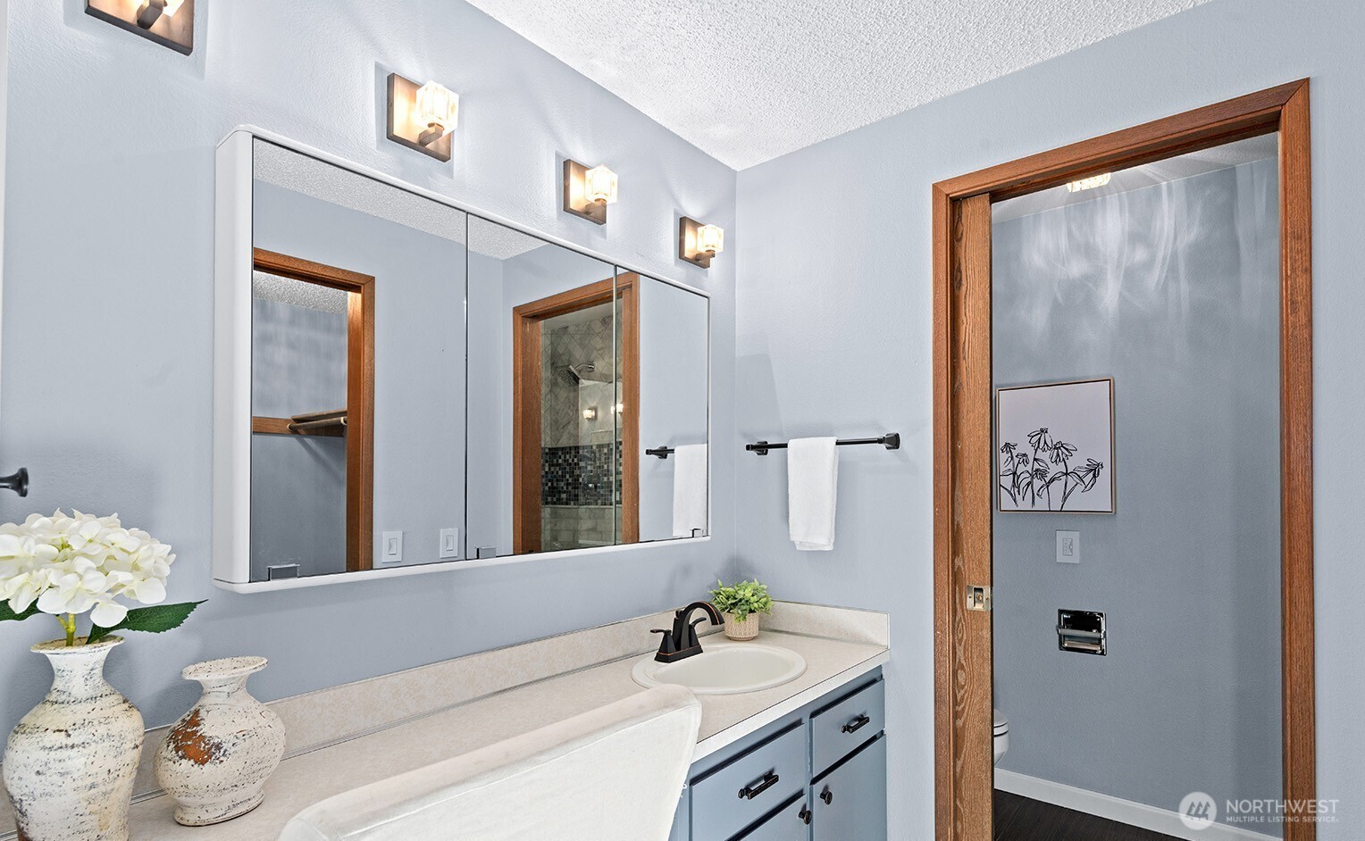 2604 177th Street Southeast Bothell, WA 98012 - Photo 17 of 35 a bathroom with a sink mirror and vanity