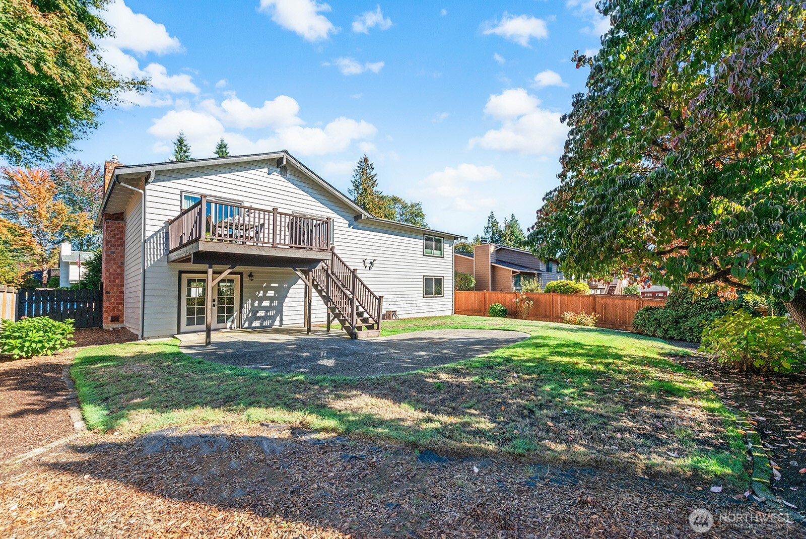 2604 177th Street Southeast Bothell, WA 98012 - Photo 28 of 35 a view of a yard in front of a house with large trees