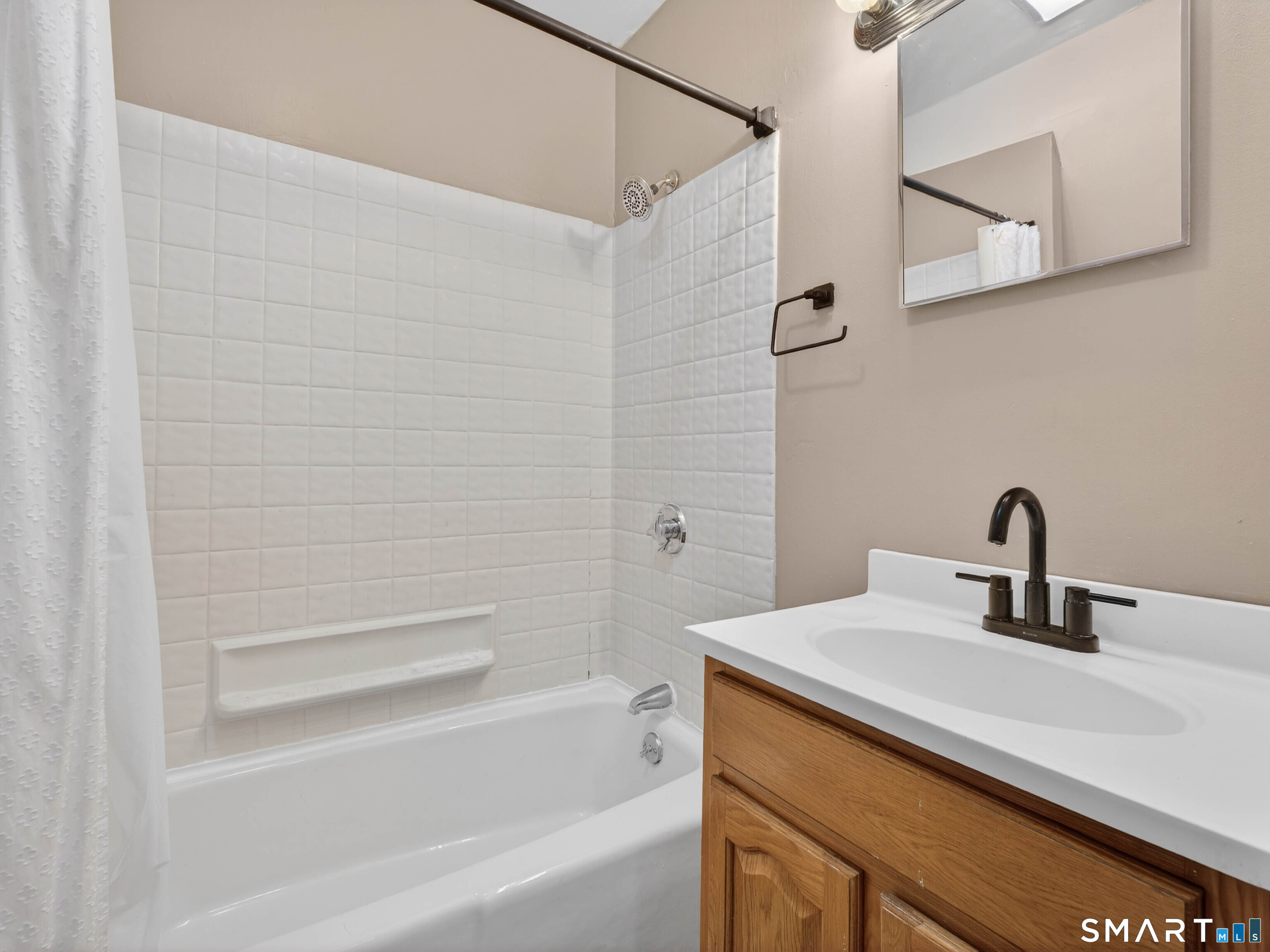 82 North Street Norwich, CT 06360 - Photo 15 of 38 a bathroom with a sink and a bathtub
