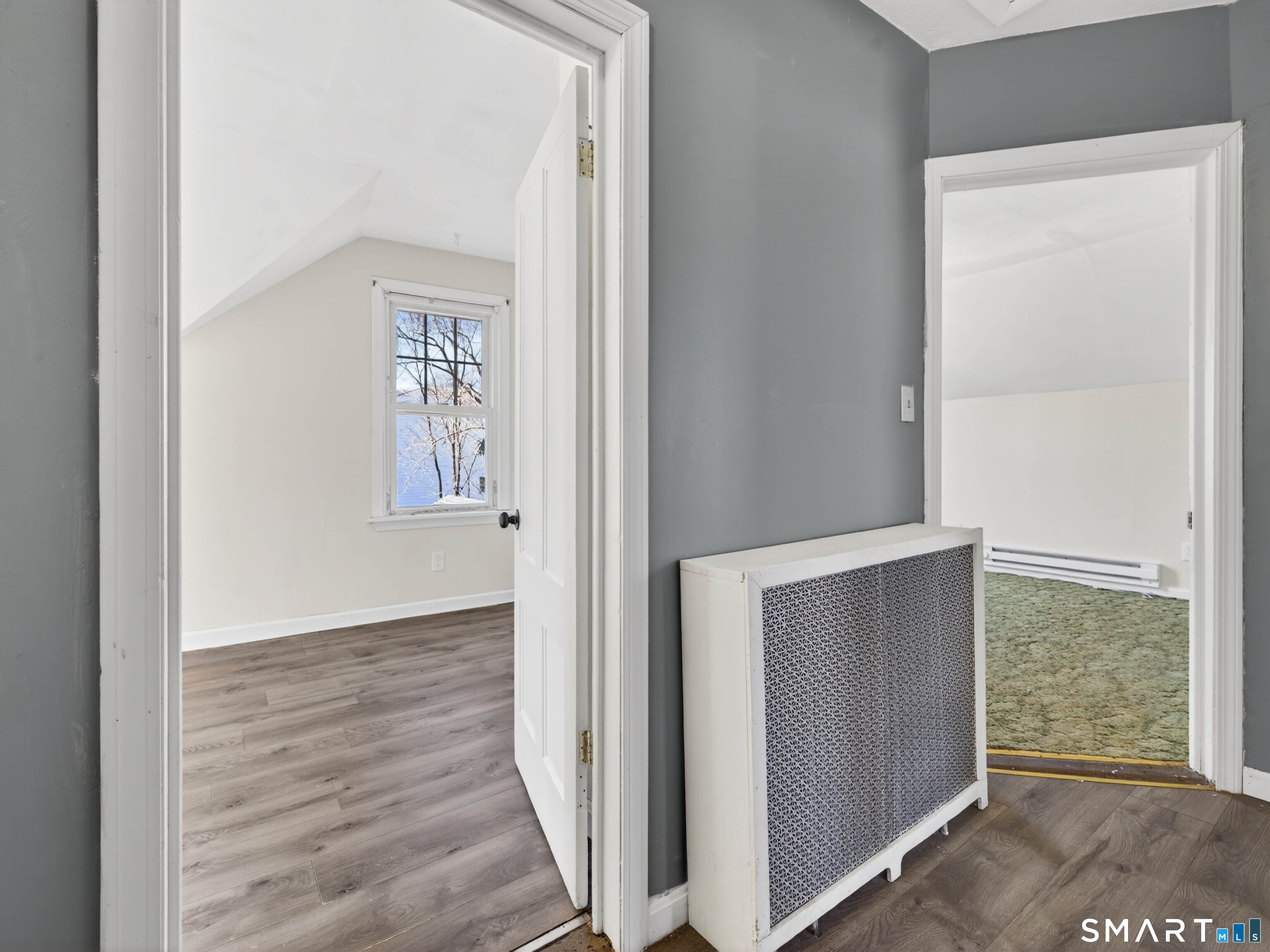 82 North Street Norwich, CT 06360 - Photo 21 of 38 an entryway with wooden floor and windows