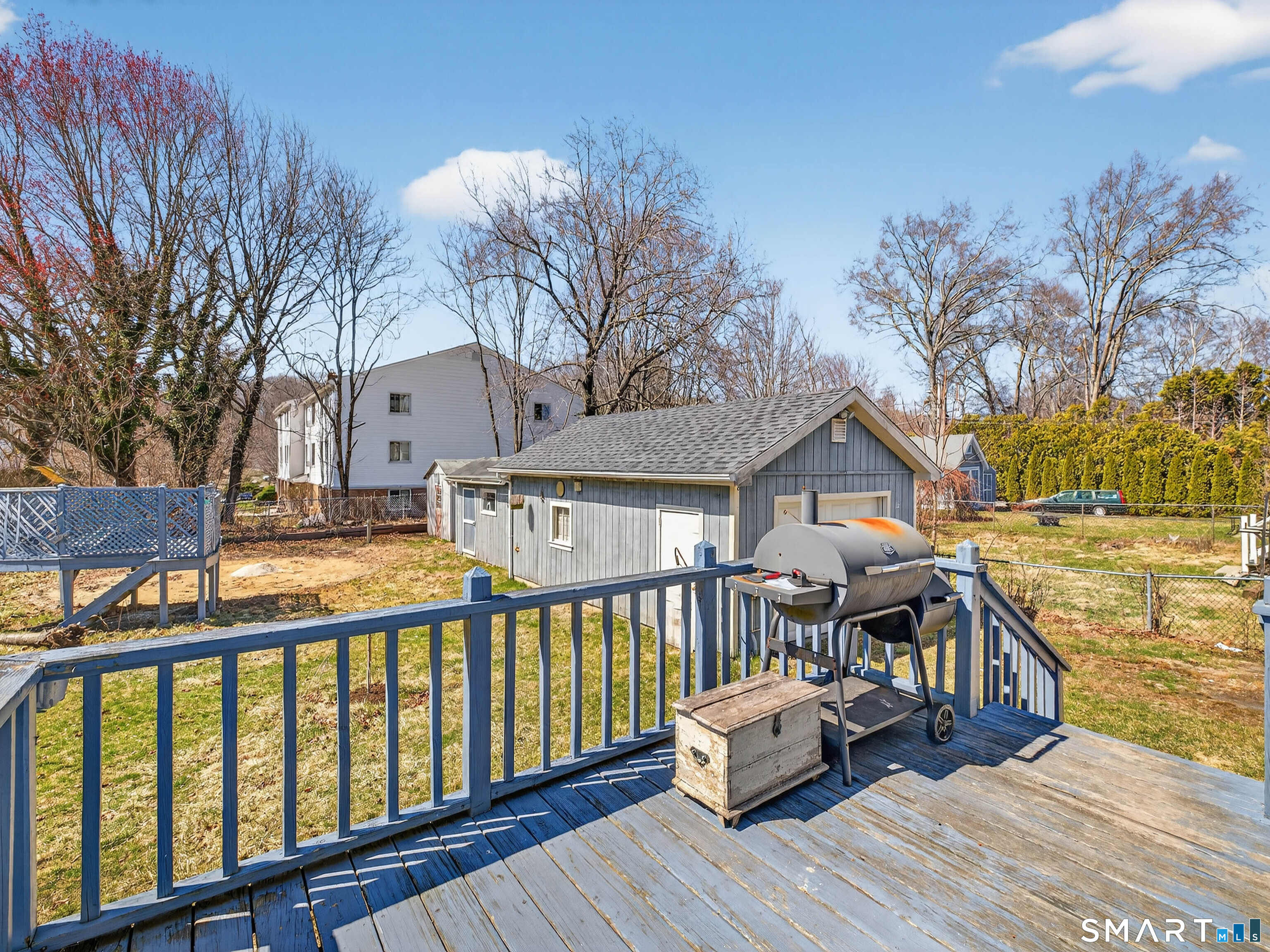 82 North Street Norwich, CT 06360 - Photo 28 of 38 a view of a deck with chairs and wooden floor