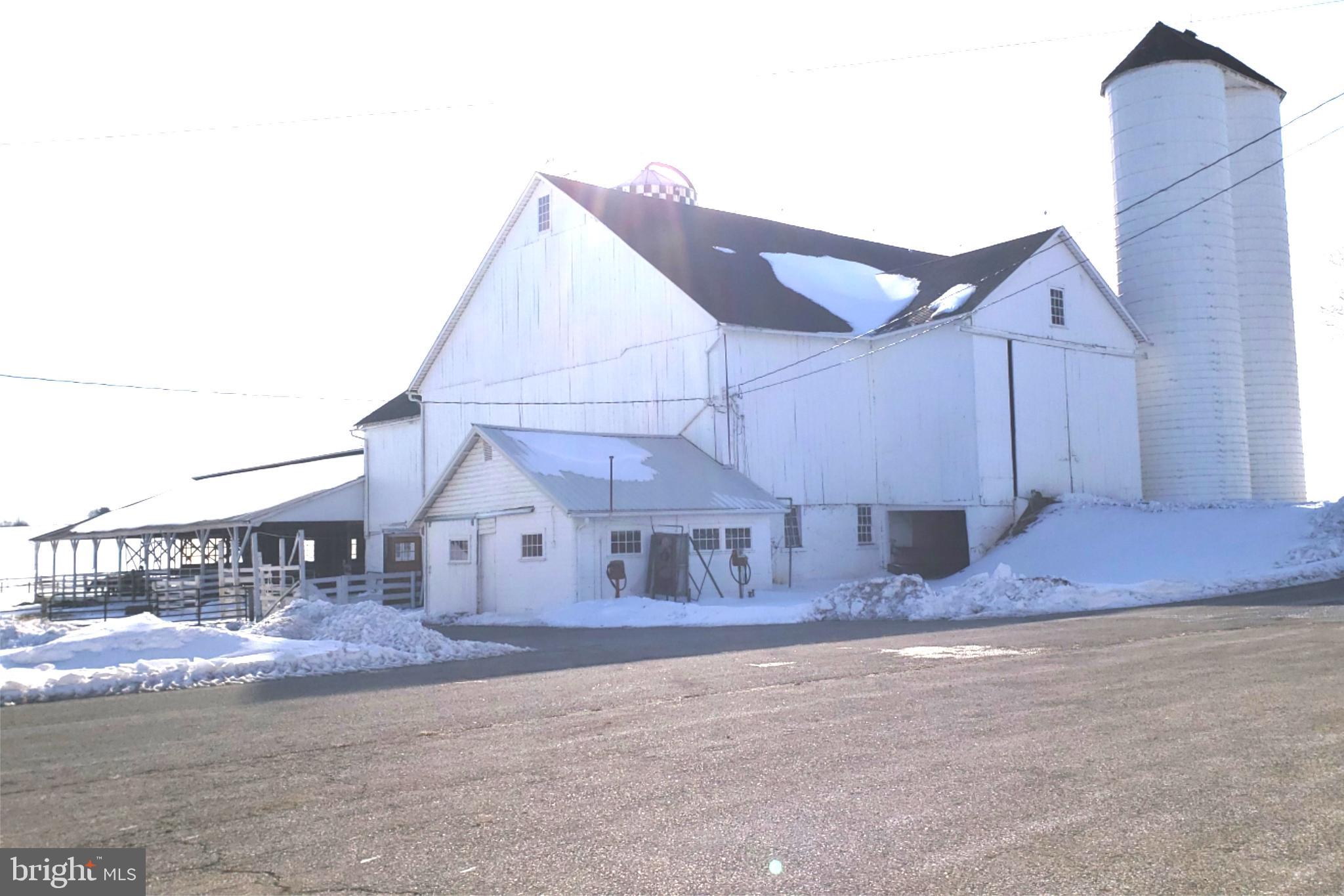 174 Fernwood Road Cochranville, PA 19330 - Photo 13 of 22 Charming white barn in a snowy landscape.