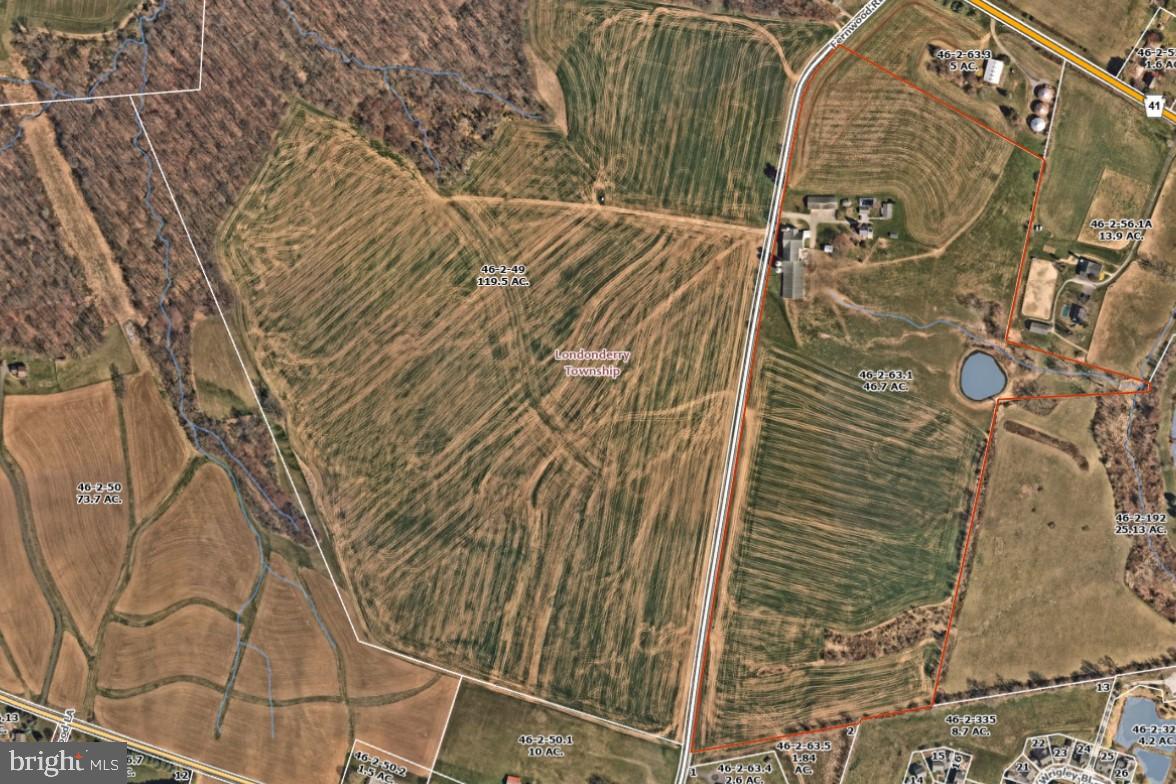 174 Fernwood Road Cochranville, PA 19330 - Photo 2 of 22 Vast green fields with winding paths.