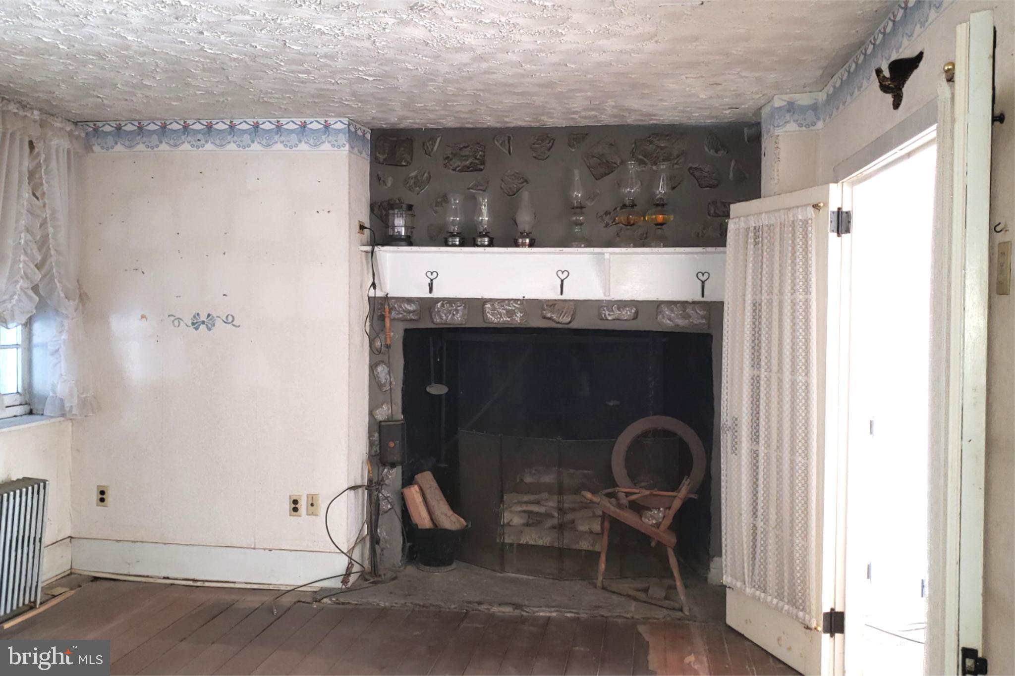 174 Fernwood Road Cochranville, PA 19330 - Photo 7 of 22 Charming vintage living space with fireplace.