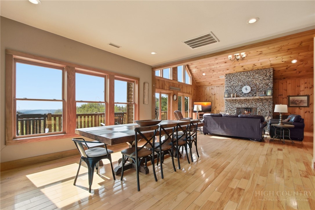 2081 Blackberry Road Boone, NC 28607 - Photo 19 of 45 a view of a dining room with furniture window and wooden floor