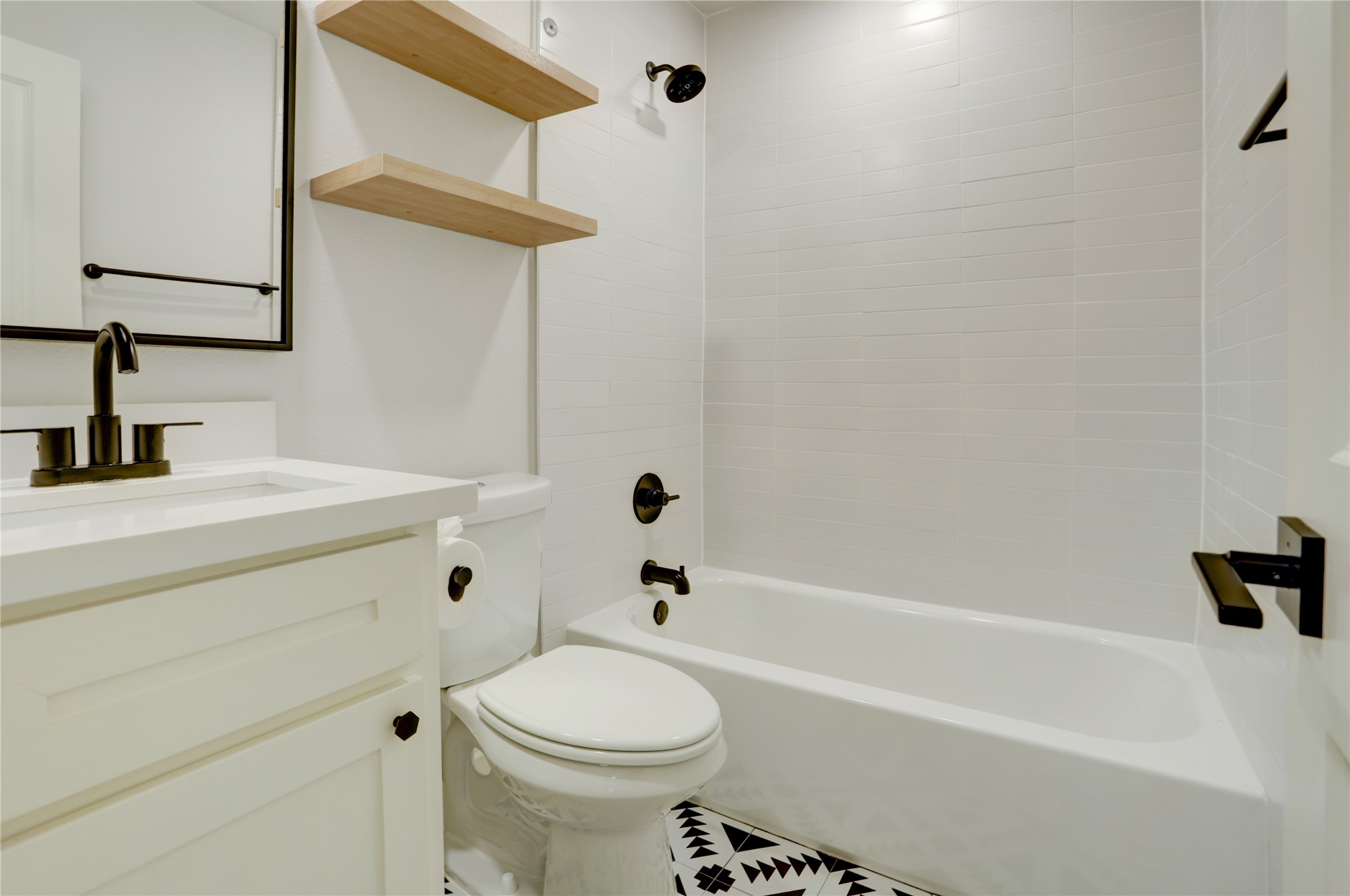 5514 Indigo Street Houston, TX 77096 - Photo 18 of 22 a bathroom with a sink a toilet and bathtub