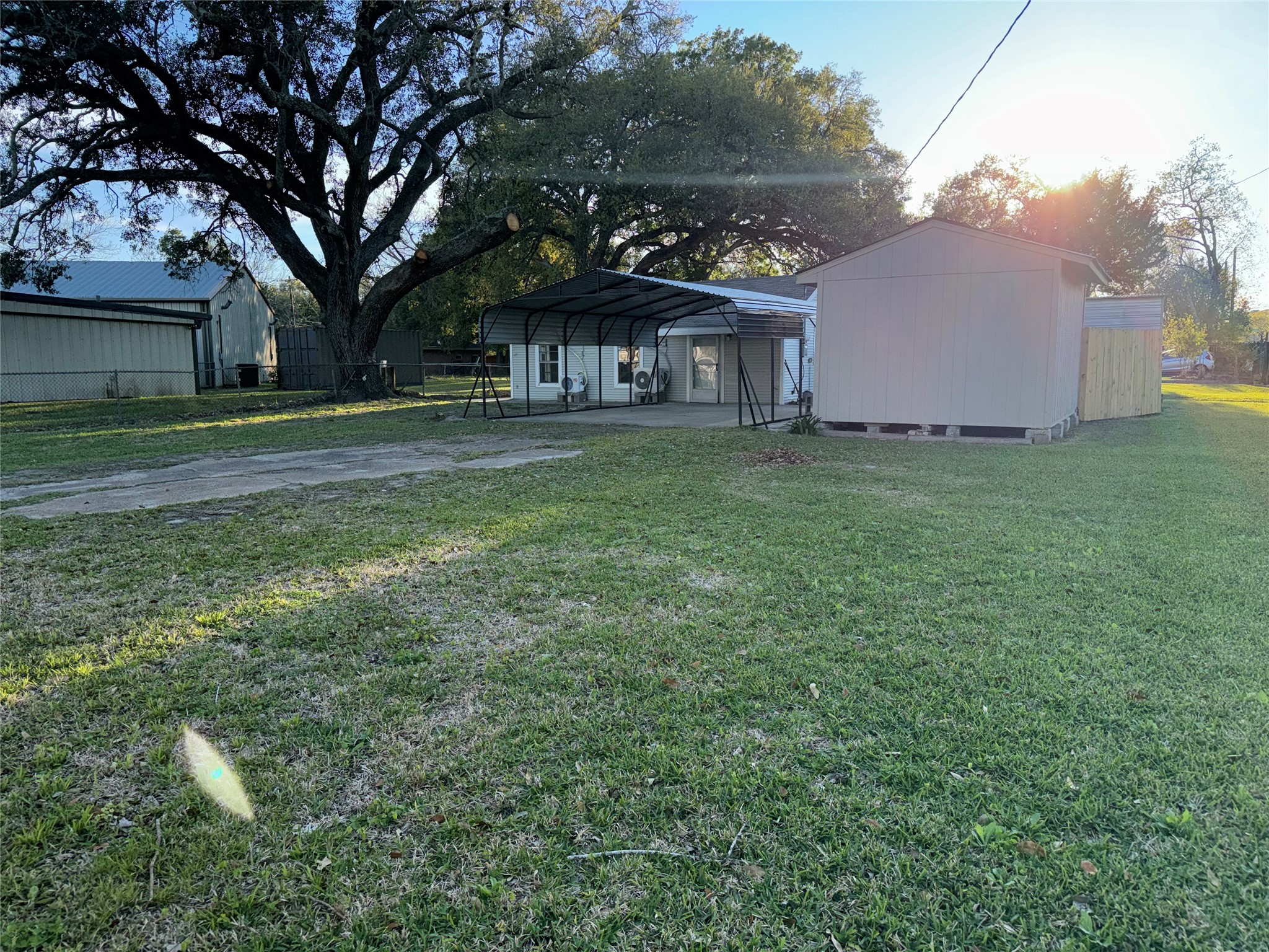 406 7th Street Alvin, TX 77511 - Photo 1 of 14 a view of a house with a yard