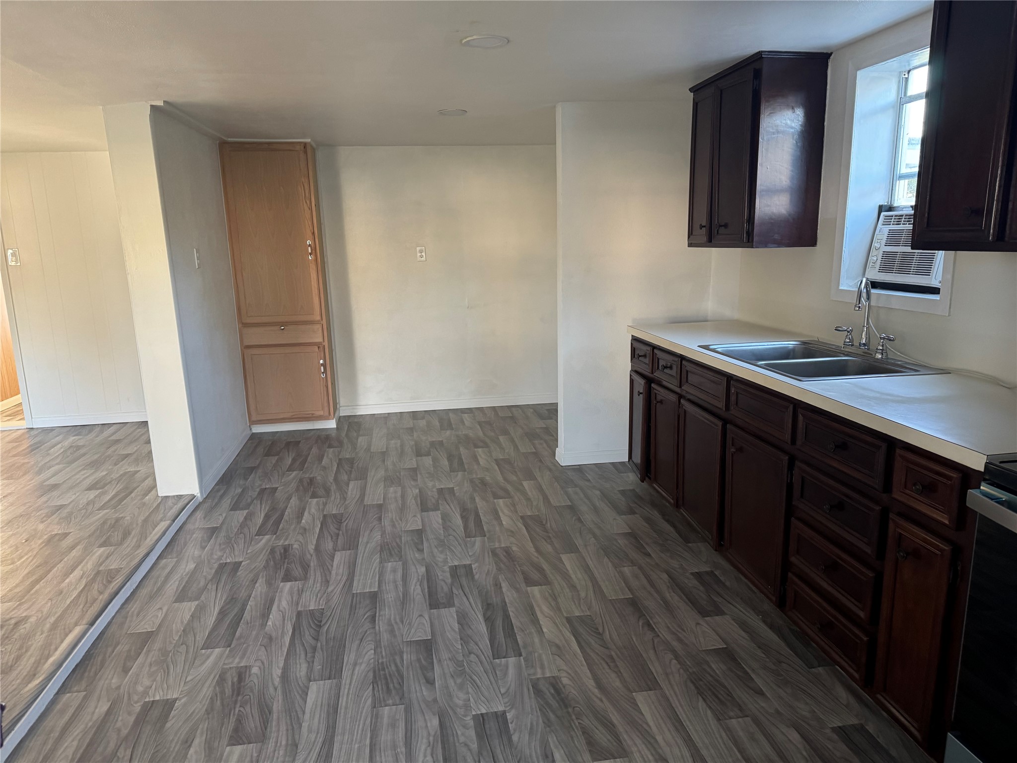 406 7th Street Alvin, TX 77511 - Photo 4 of 14 a view of a kitchen from the hallway