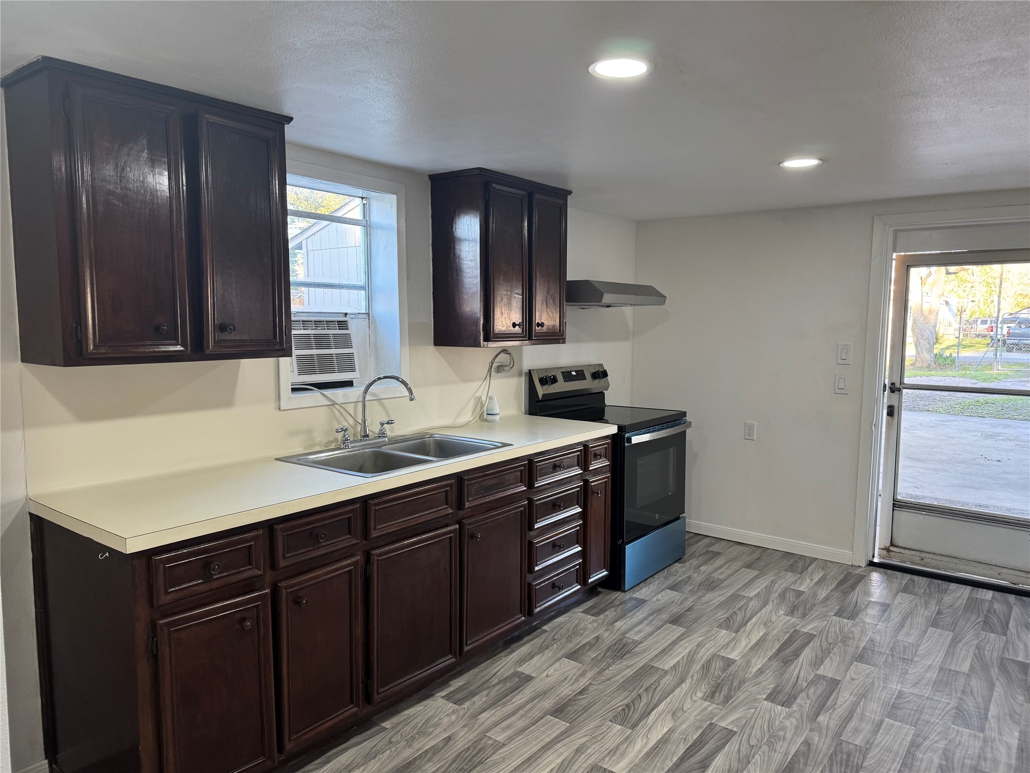 406 7th Street Alvin, TX 77511 - Photo 6 of 14 a spacious bathroom with a double vanity sink and a mirror