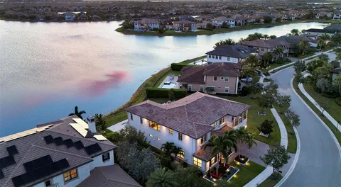 a view of a lake with houses in the back