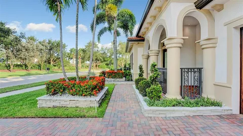 a view of a dining room with furniture and a chandelier