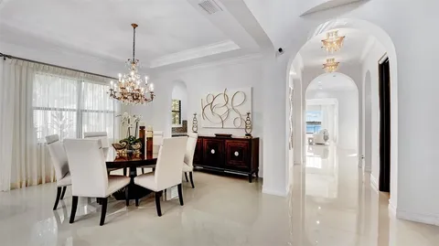 a kitchen with stainless steel appliances kitchen island granite countertop a refrigerator and microwave