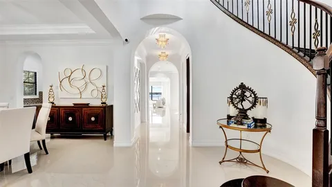 a large kitchen with a table and chairs