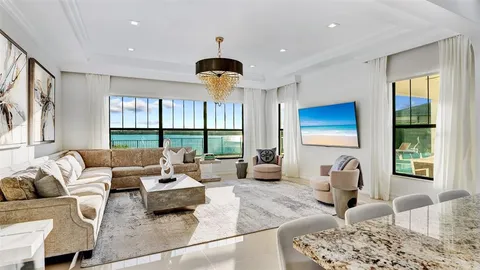 a kitchen with granite countertop kitchen island stainless steel appliances a refrigerator a sink a stove and cabinets