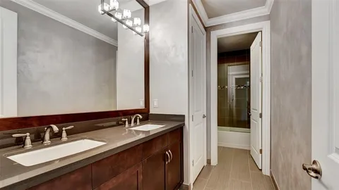 a front view of a house with a yard and palm trees