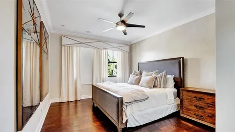 a front view of a house with a yard and green space