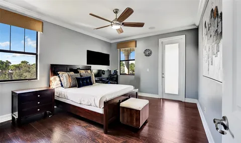 a view of a house with swimming pool and sitting area