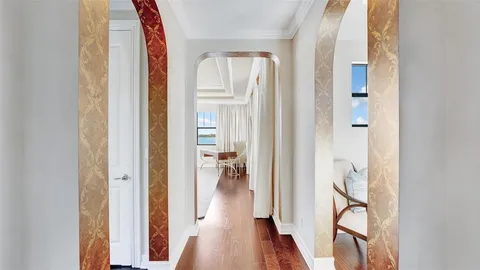 a view of a house with swimming pool and sitting area