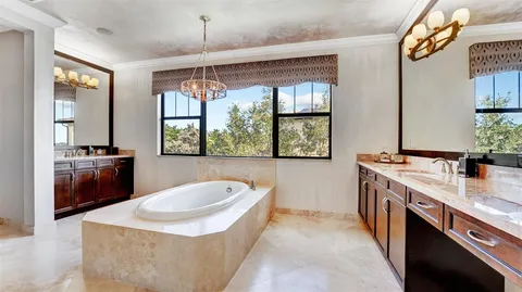 an outdoor space with pool and furniture