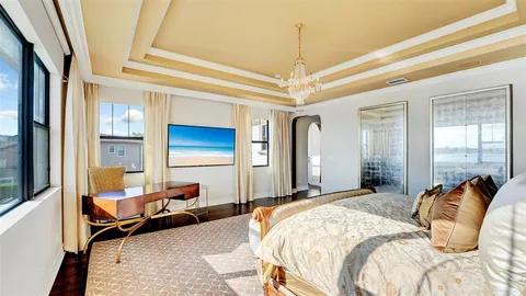 a living room with furniture a dining table and chairs with floor to ceiling window