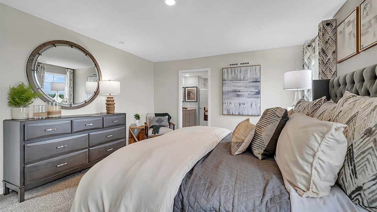 6719 Applegate Drive Plainfield, IL 60586 - Photo 34 of 39 a bed room with a bed and a mirror