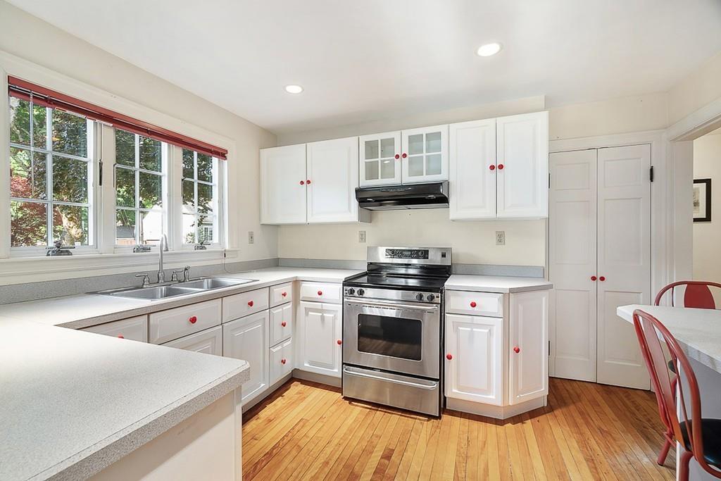79 Pleasant Street Manchester, MA 01944 - Photo 11 of 28 a kitchen with stainless steel appliances granite countertop a stove a sink and a refrigerator