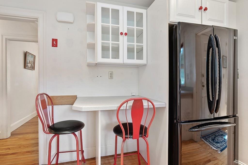 79 Pleasant Street Manchester, MA 01944 - Photo 13 of 28 a view of a dining room with furniture and wooden floor