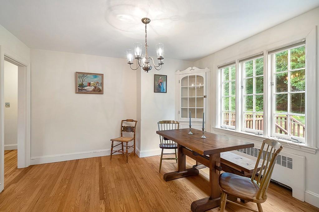 79 Pleasant Street Manchester, MA 01944 - Photo 14 of 28 a view of a dining room with furniture wooden floor and chandelier